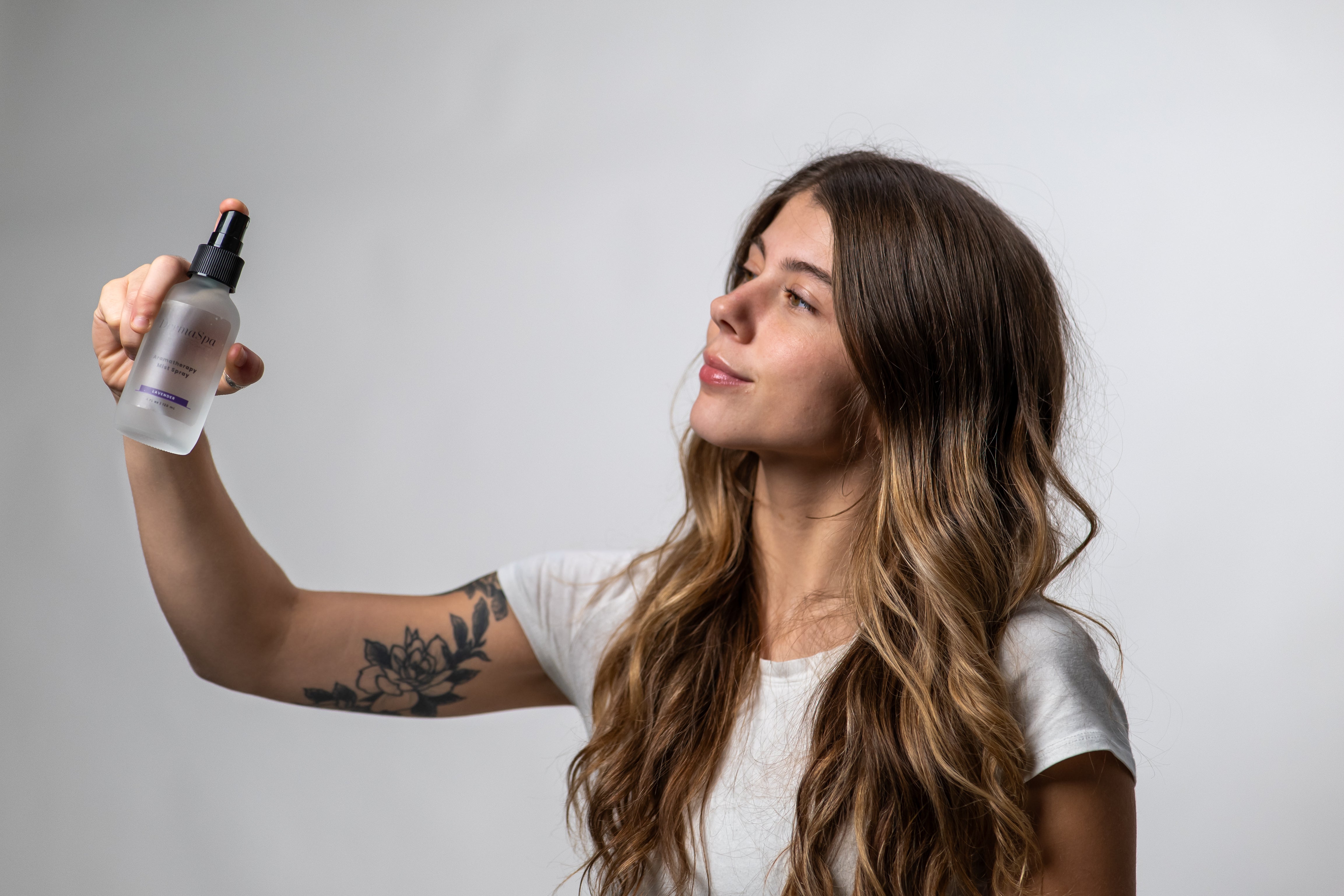 Cozy woman with DermaSpa eye mask reading a book